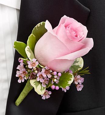 Who wears a boutonniere in a wedding?
