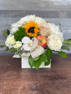 Apple & Honey Blessing Rosh Hashanah flower arrangement with hydrangea, roses, sunflowers, orchids, dianthus, greenery and apple in keepsake container