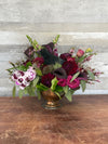 Raven’s Enchantment Halloween flower arrangement with dahlias, orchids, roses, and raven accent by Lia’s Flowers, West Hills florist 