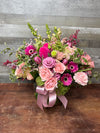 Pink and blush flower arrangement with roses, gerbera daisies, and a soft pink ribbon in a clear glass vase by Lia’s Flowers - Pic 6